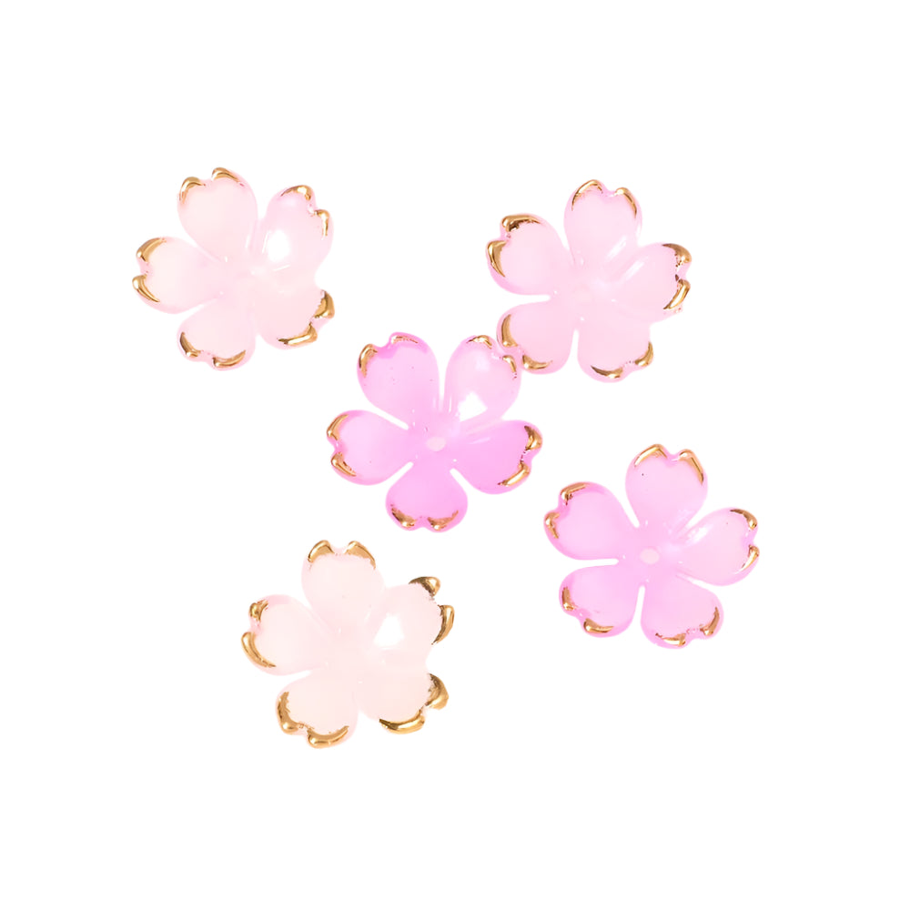 Quatre coupelles fleurs en acrylique rose transparent avec bordure dorée.