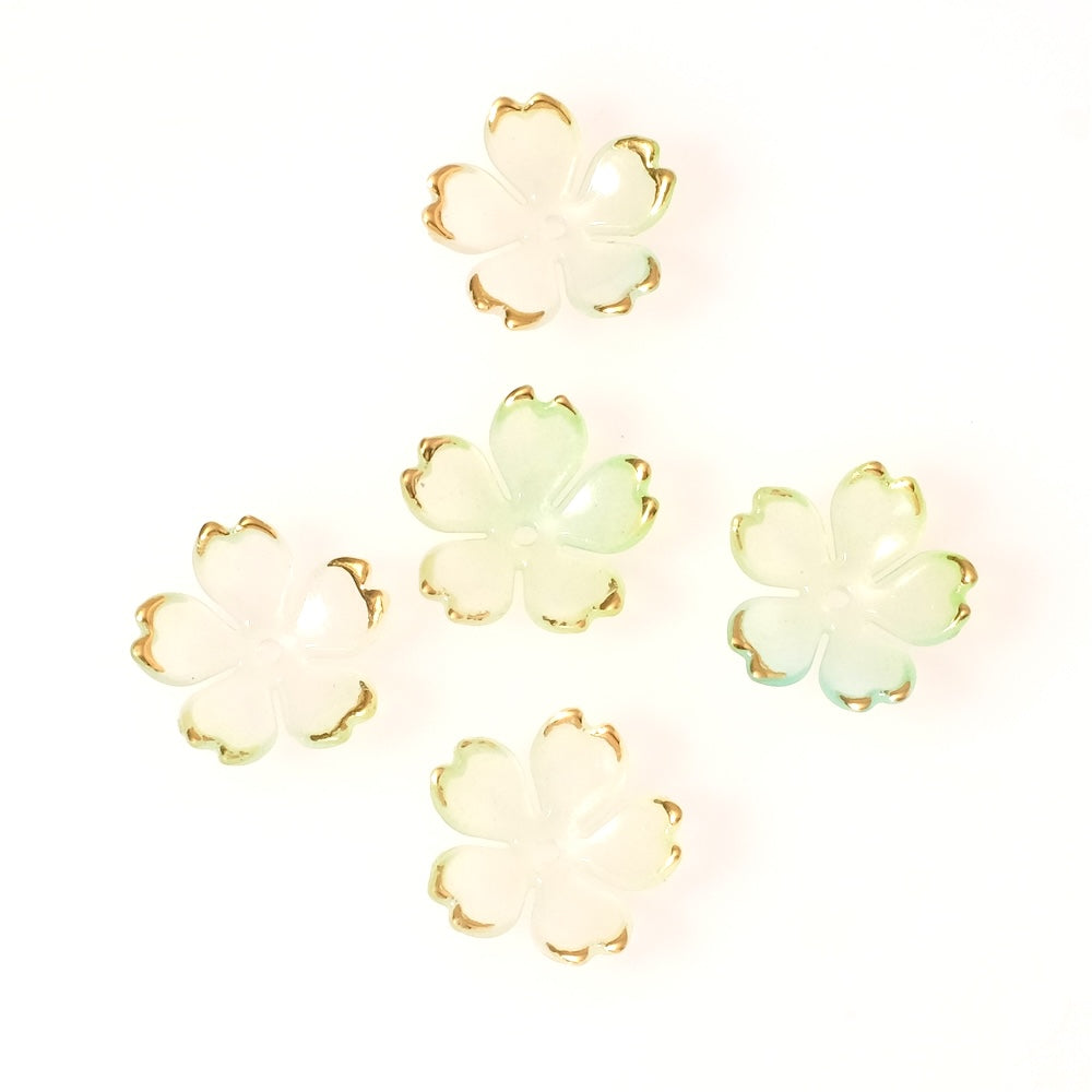 4 coupelles fleurs en acrylique vert pastel transparent avec bordure dorée.