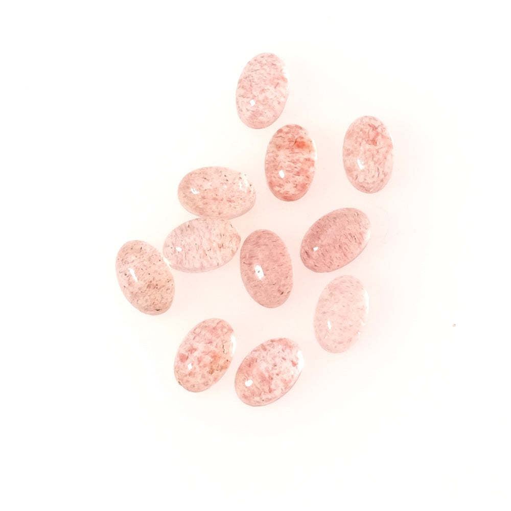 Cabochons ovales en quartz fraise de 6x4mm.