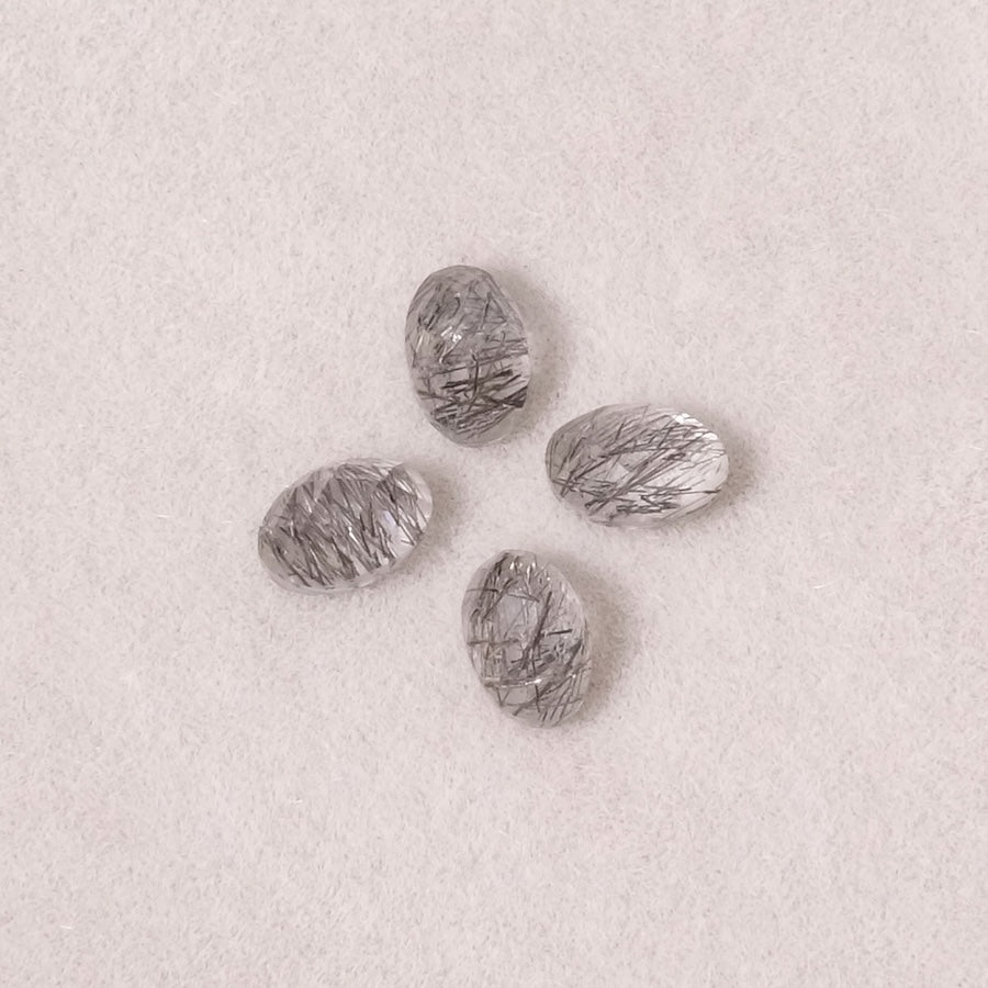 Cabochons ovales en quartz rutile noir facetté de 6x4mm.