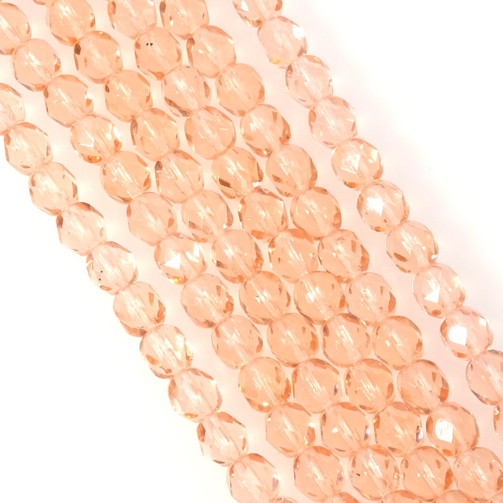 Fil de perles rondes facettées rose transparent de 6mm.