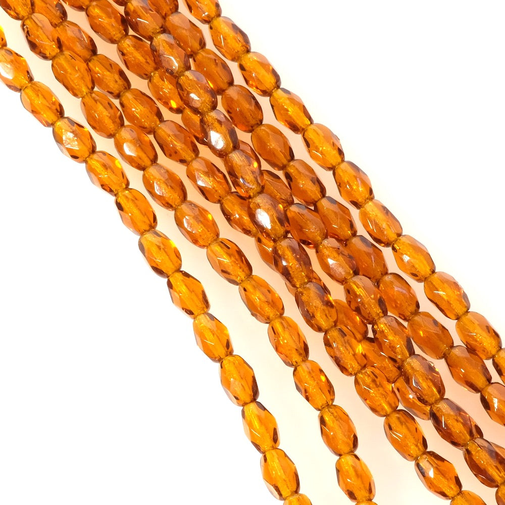 Fil de perles de Bohème olives facettées 6x4mm marron transparent.