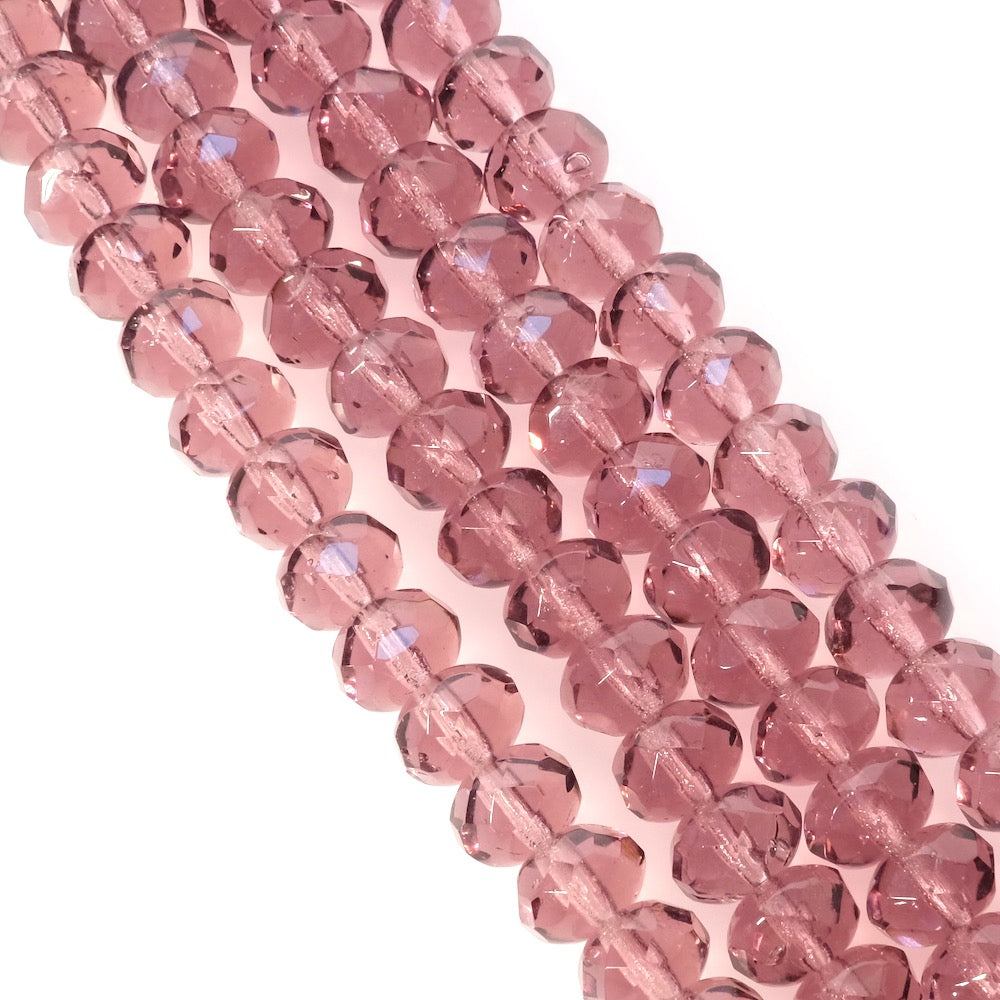 Fil de perles de Bohème transparentes lie de vin facettées 6x8mm.