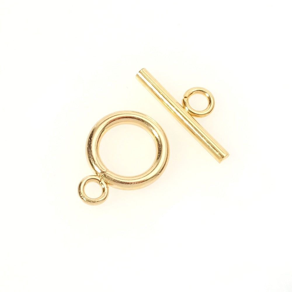 Fermoir toggle doré en acier inoxydable avec anneau de jonction.