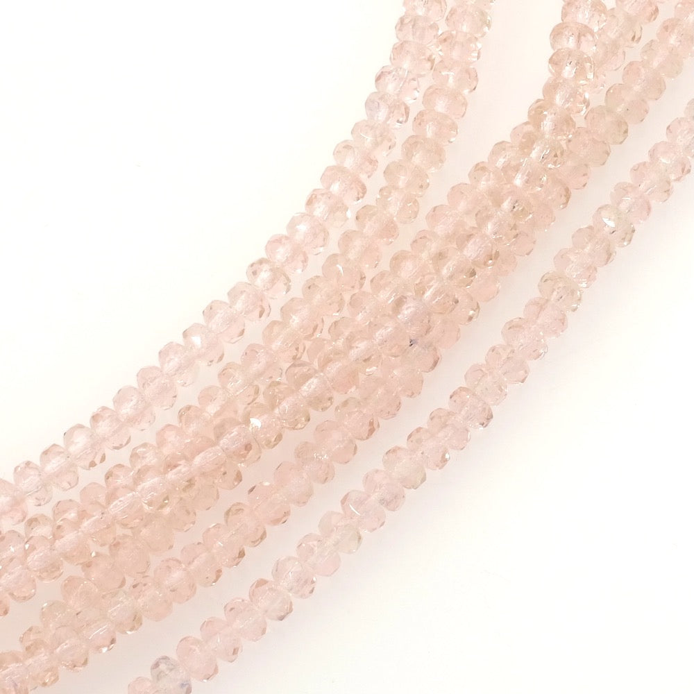 Fil de perles roses transparentes facettées de 2x3mm.