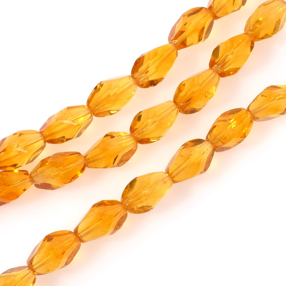 Fil de perles de Bohème olives facettées miel transparent 15x10mm.