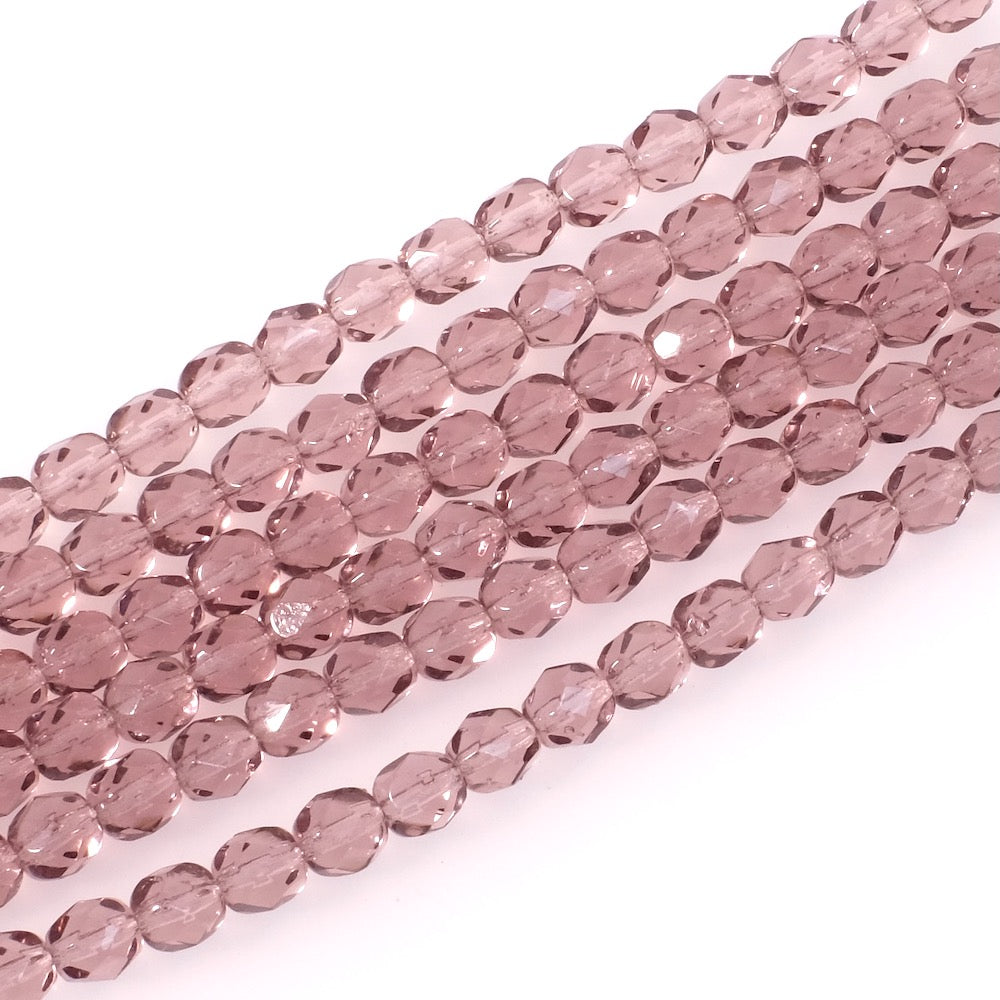 Fil de perles rondes facettées violettes transparentes de 6mm.