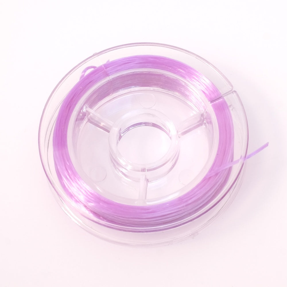 Bobine de fil élastique plat violet orchidée de 0,6 mm.