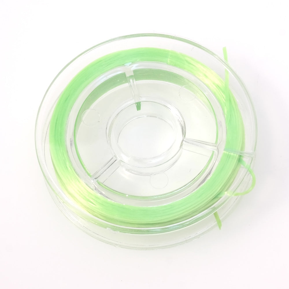 Bobine de fil élastique plat vert fluo de 0,6 mm.