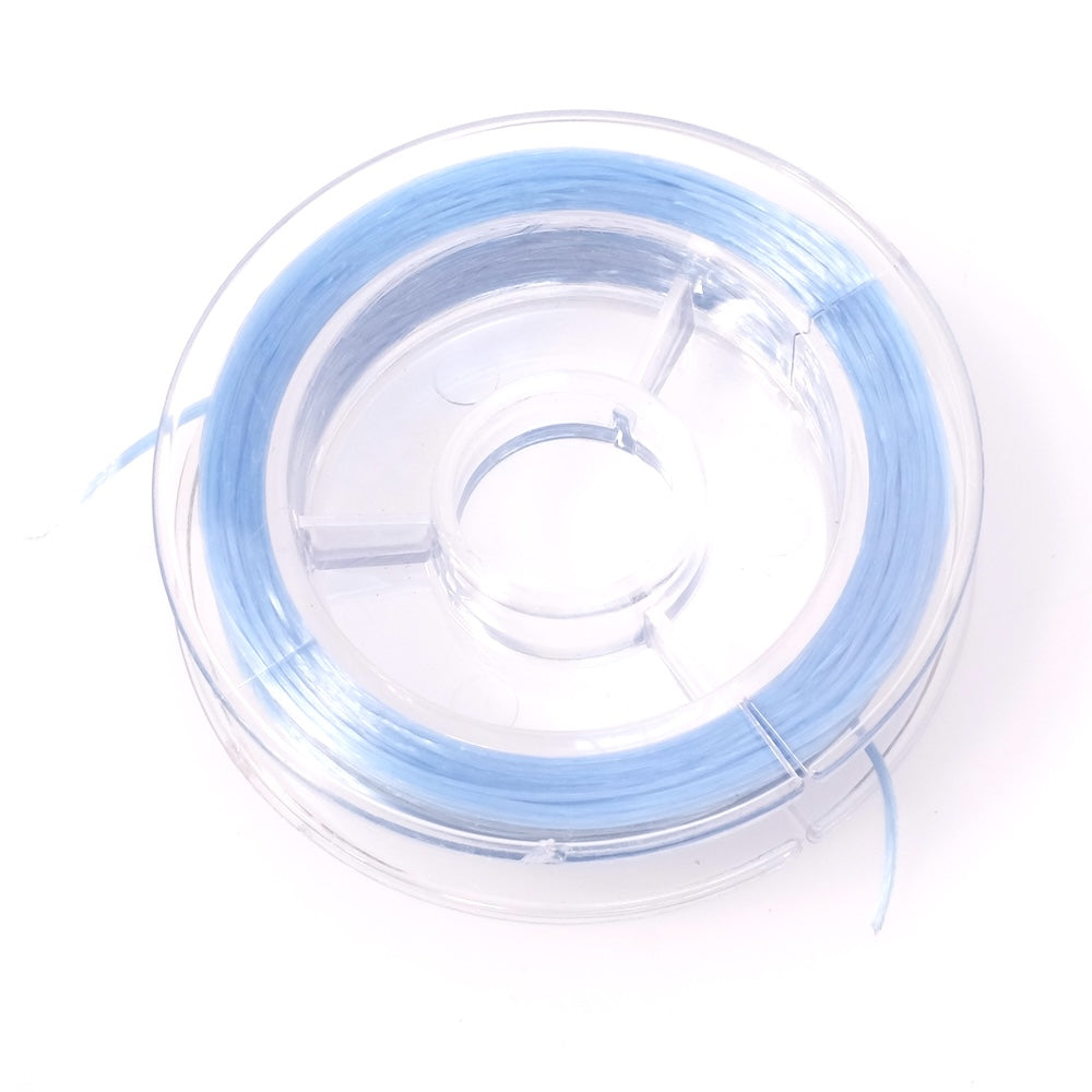 Bobine de fil élastique plat bleu pastel de 0,6 mm.