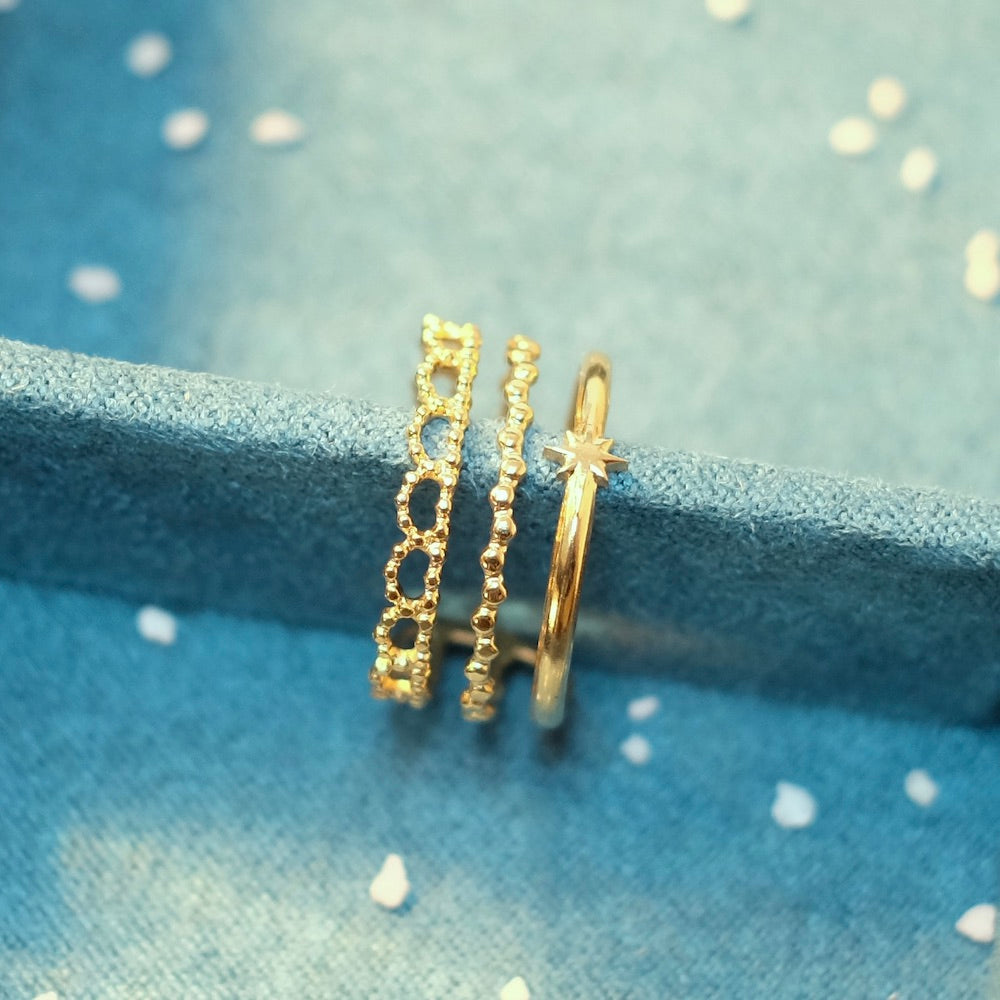 Bague triple étoile dorée en acier inoxydable ajustable.