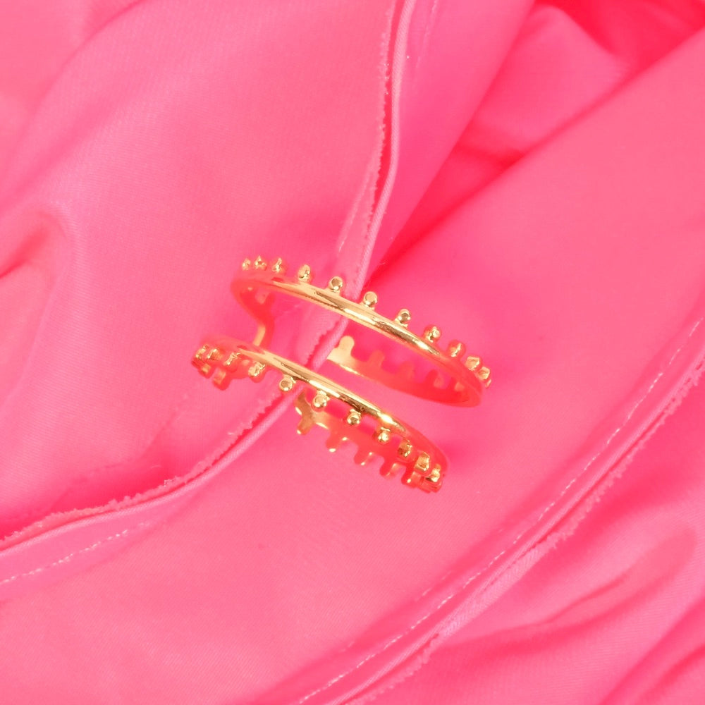 Bague double en acier inoxydable doré 14K avec bordure de boules.