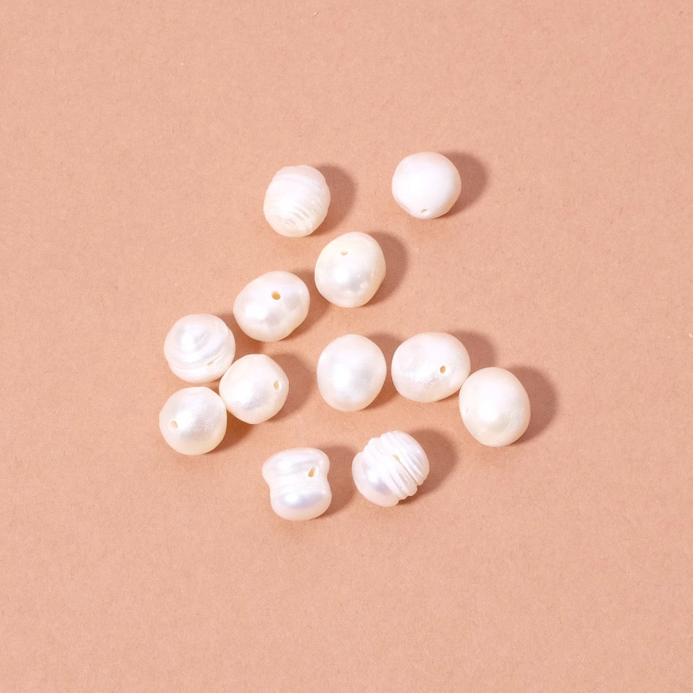 10 perles ovales irrégulières de Nacre naturelle