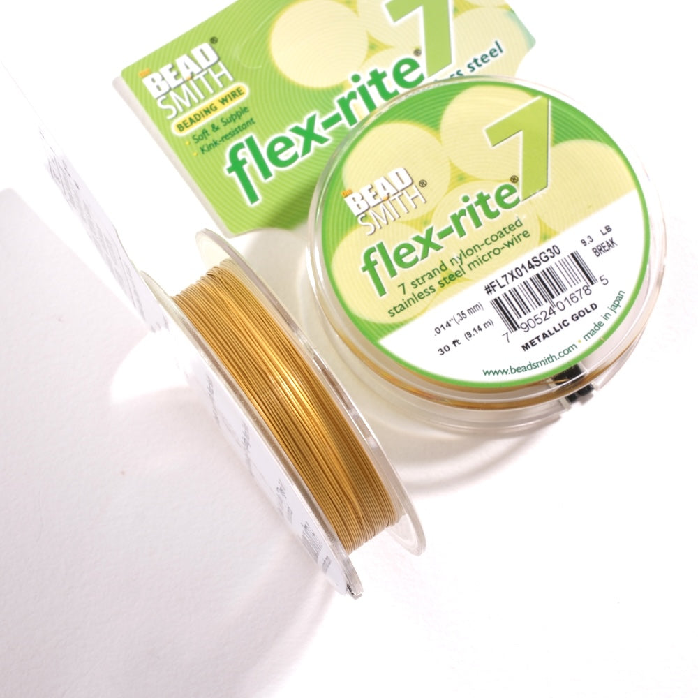 Détail du fil Flex-rite doré, câble d'acier 7 brins gainé de nylon.