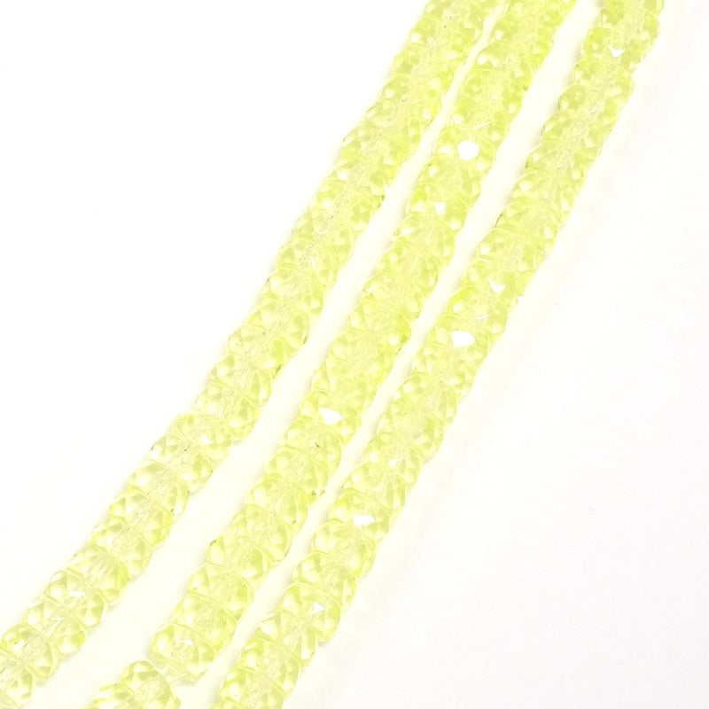 Trois fils de perles rondelles facettées jaune transparent 3x6mm.