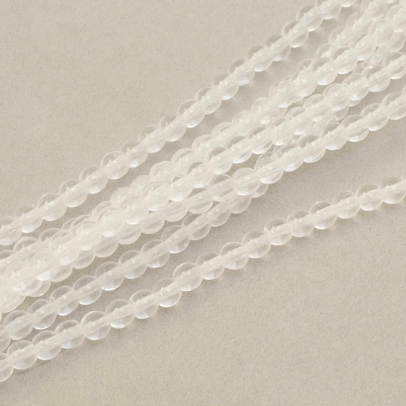 Fil de perles rondes transparentes de 4mm.