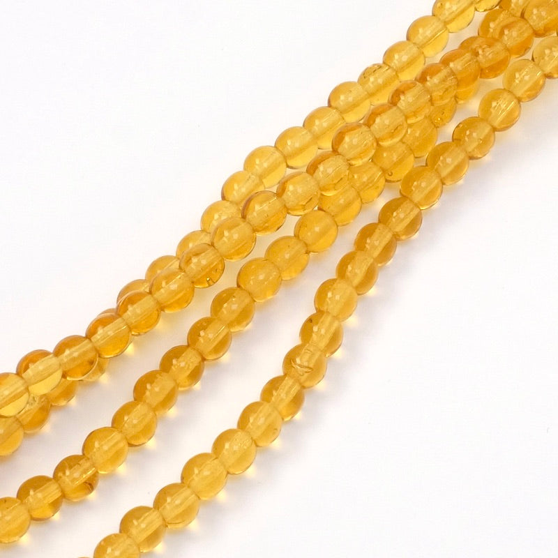 Fil de perles rondes en verre ambre transparent de 4mm.