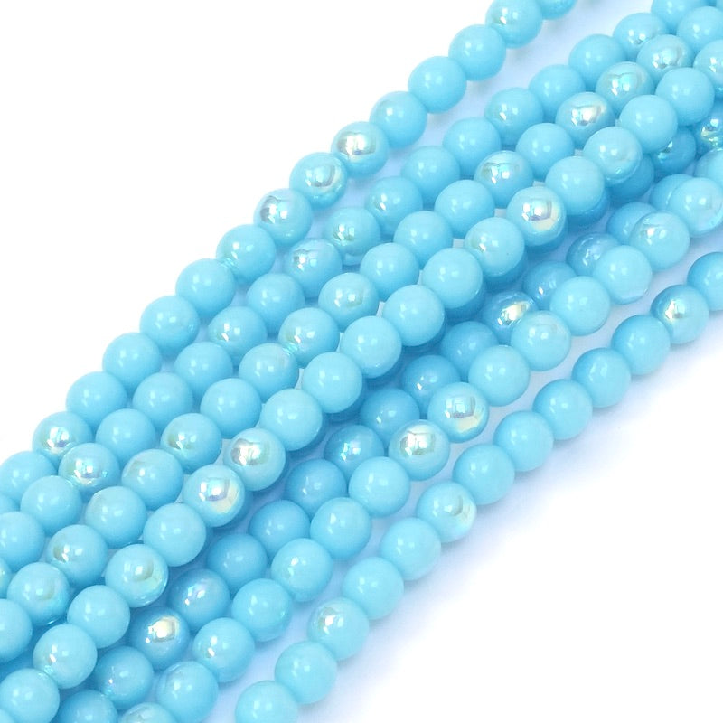 Fil de perles rondes bleues irisées AB de 4mm.