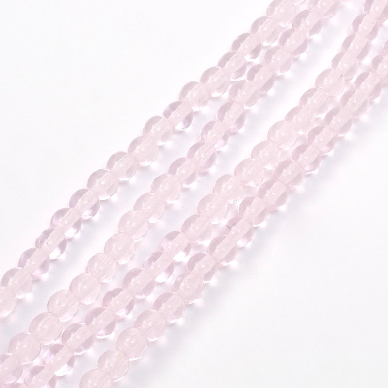 Fil de perles rondes en verre rose clair transparent de 4mm.