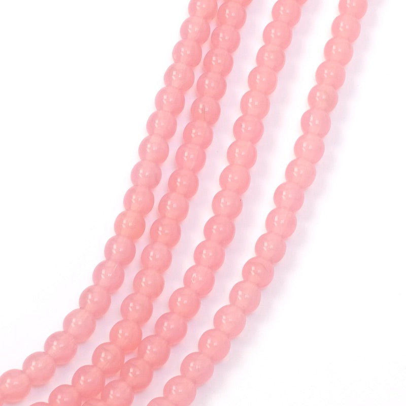 Fil de perles rondes 4mm rose transparent.