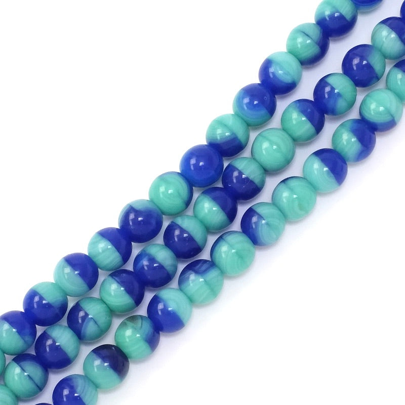 Fil de perles rondes 6mm bleues et turquoise.