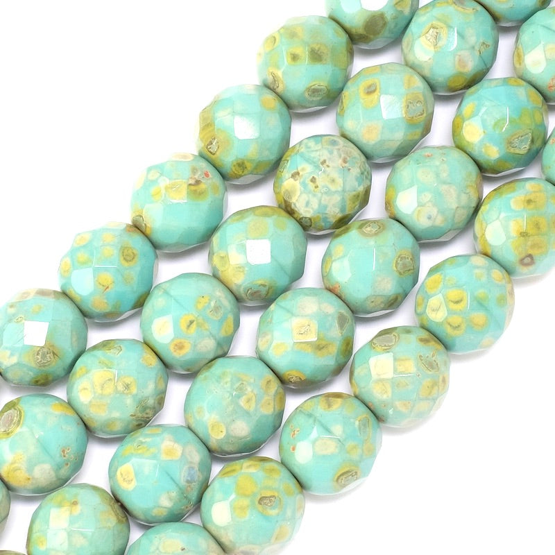 Fil de perles rondes facettées vert turquoise et orange.
