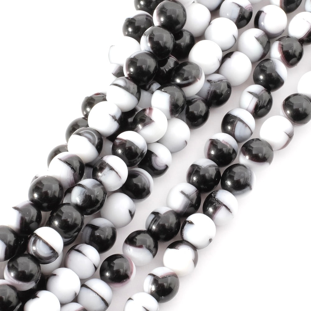 Fil de perles rondes en verre blanc et noir de 6mm.