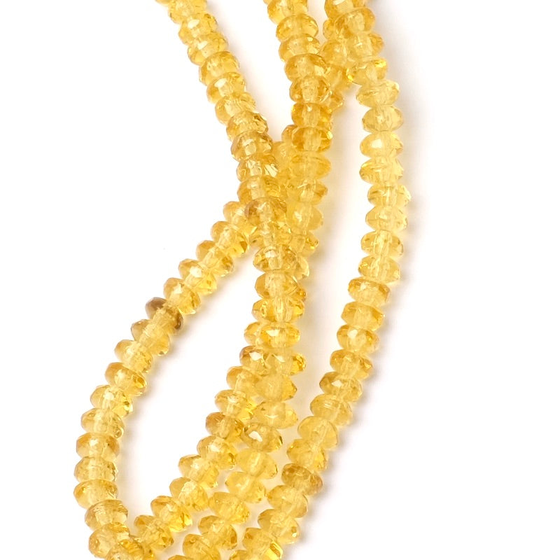 Fil de perles de Bohème facettées jaune orangé transparent 2x4mm