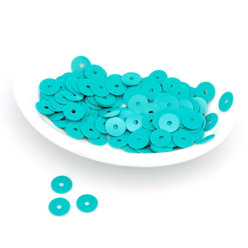 Lot de sequins pastilles Heishi en acrylique turquoise.