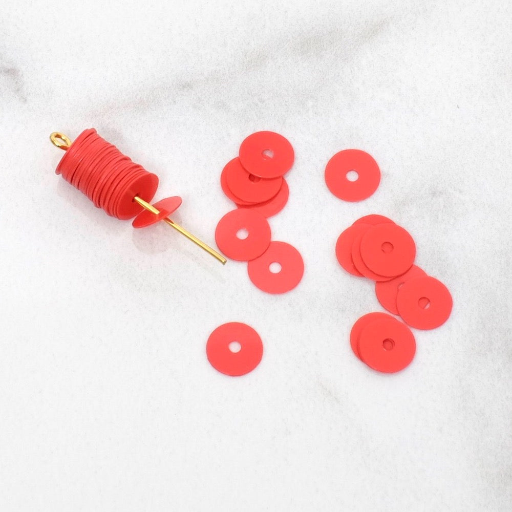 Sequins pastilles Heishi en acrylique Corail intense de 6mm.