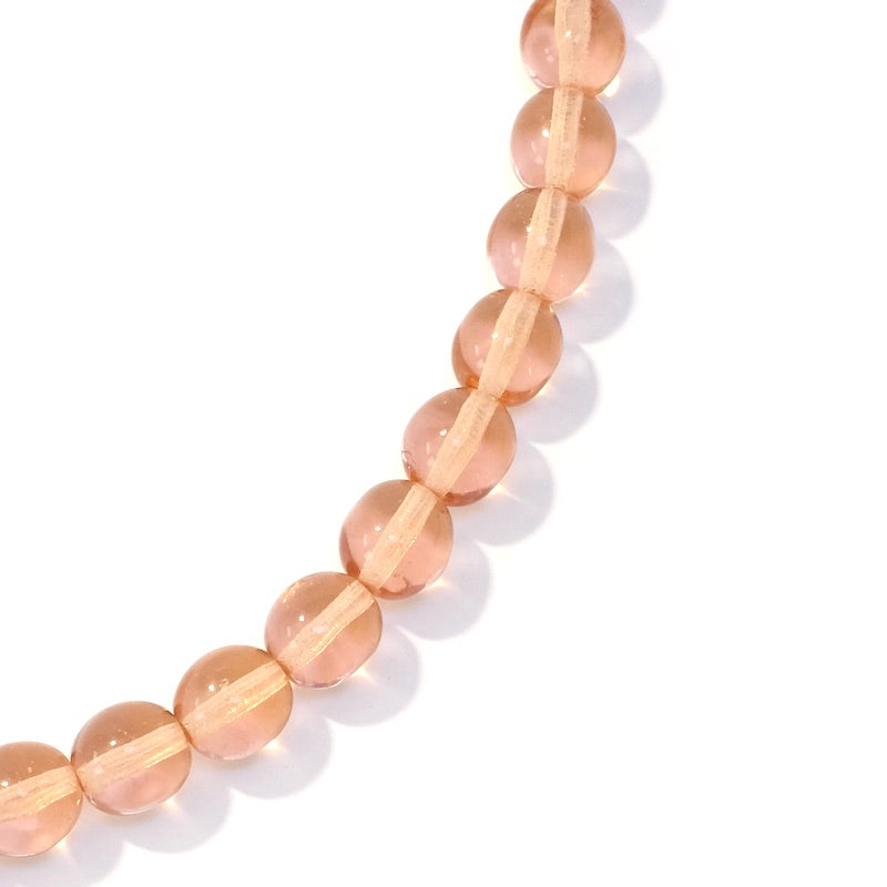 Fil de perles rondes en verre pêche transparent de 8mm.