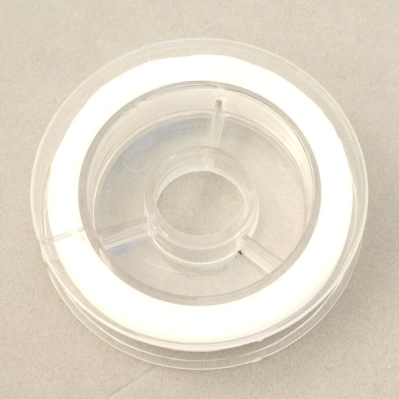 Bobine de fil élastique plat transparent de 0,6 mm.