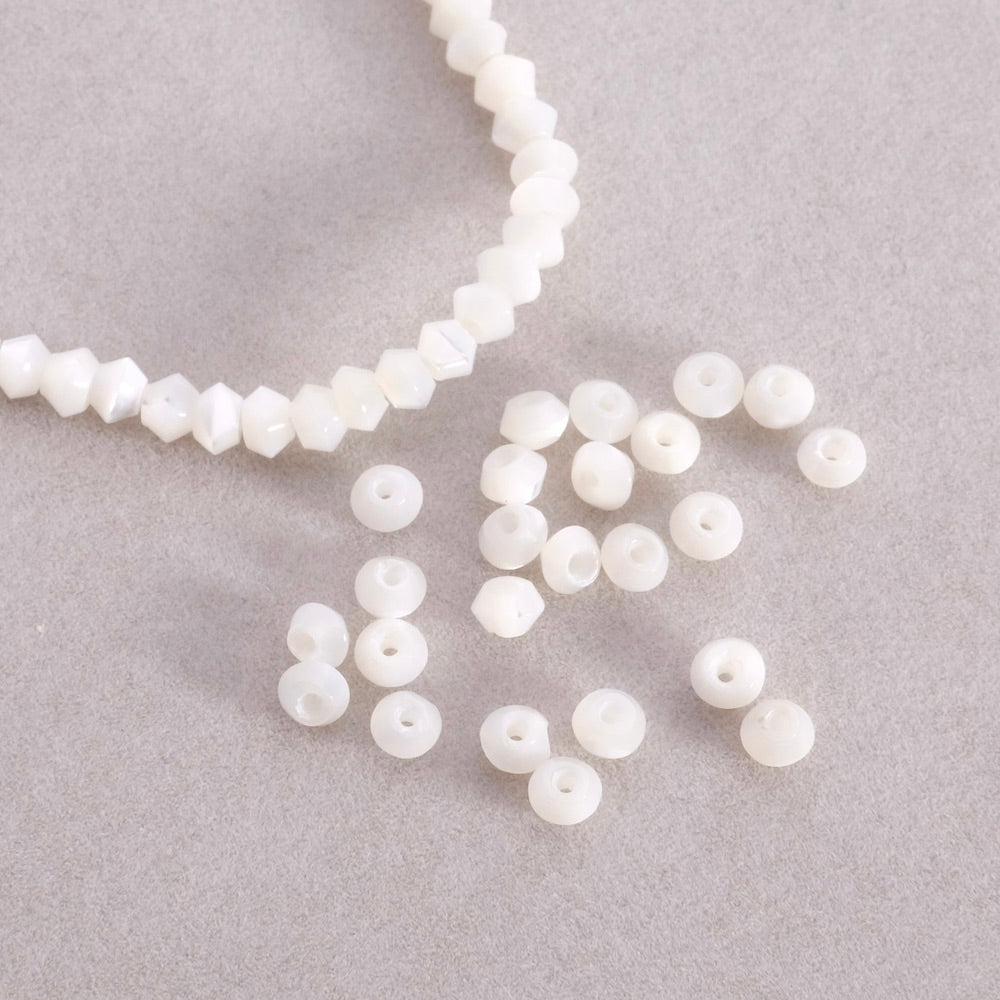 10 petites perles toupies irrégulières de Nacre naturelle