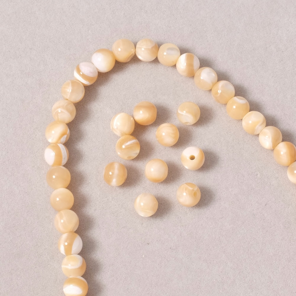 Fil de perles rondes 6mm en Nacre naturelle beige
