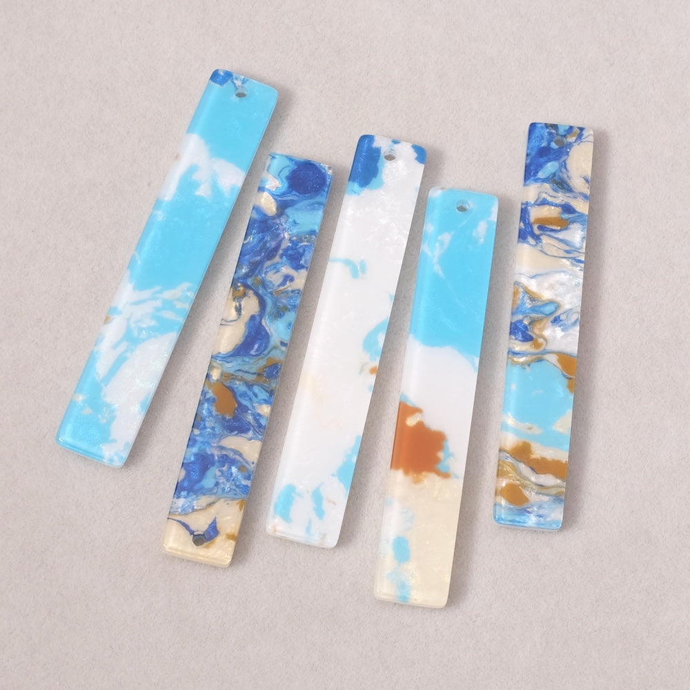 2 pendentifs rectangles en acétate Bleu ocre turquoise blanc irisé