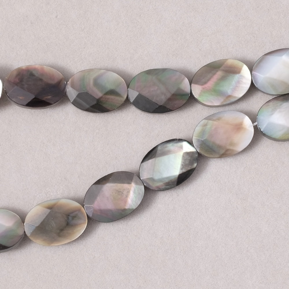 2 perles ovales facettées 10x14mm en Nacre noire très belle qualité