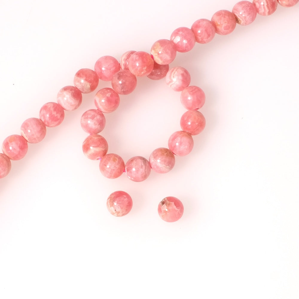 2 perles rondes 8mm naturelles en Rhodochrosite