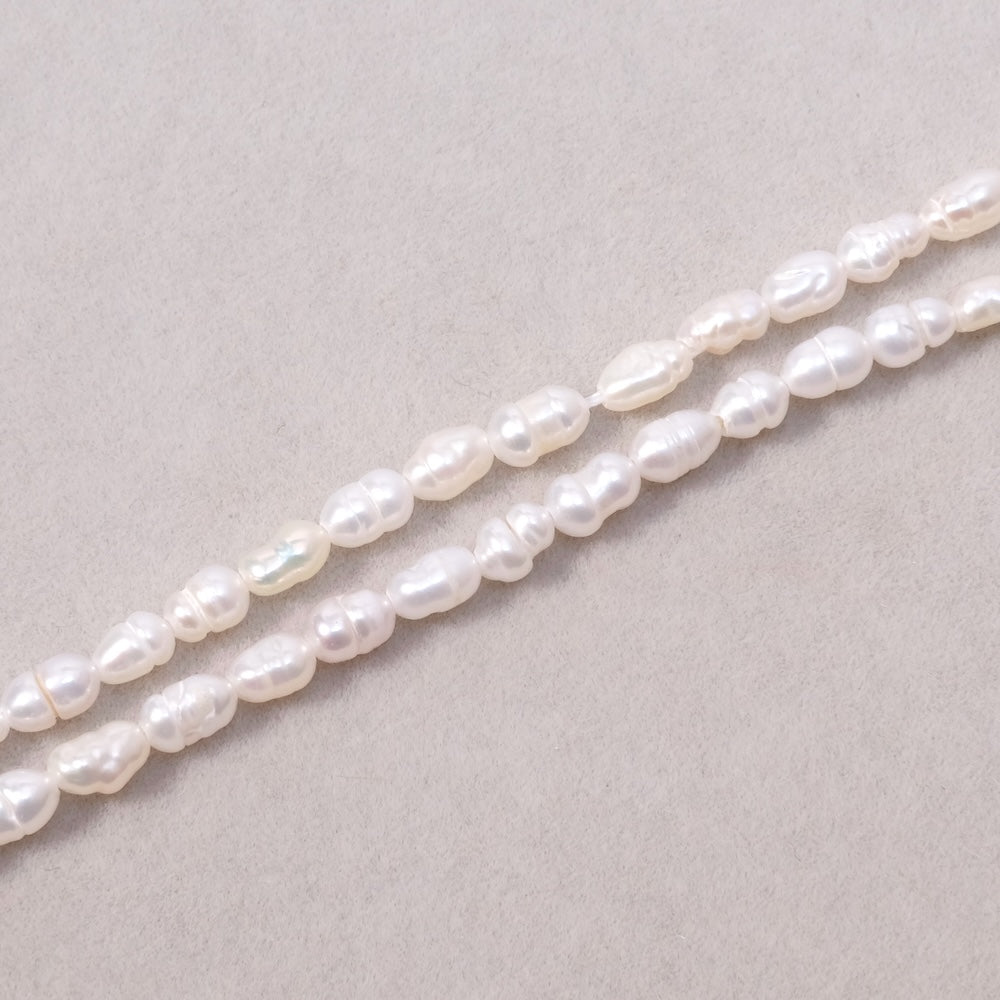 Fil de perles ovales 3x6mm irrégulières de Nacre naturelle