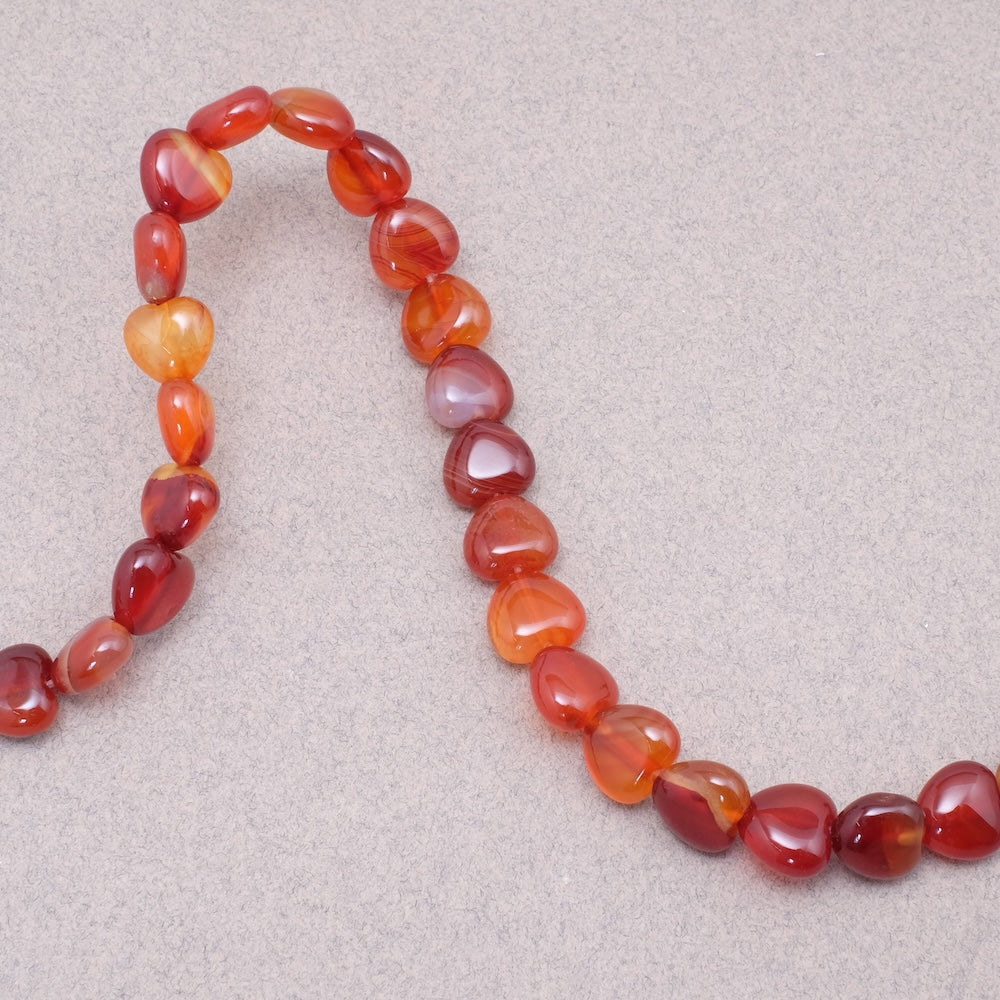 4 perles cœur en Agate naturelle rouge orange.