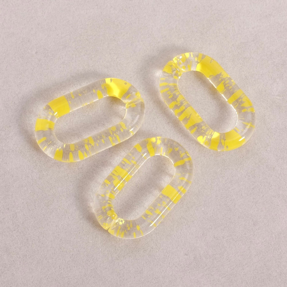 4 maillons ovale 27mm en acétate transparent moucheté jaune