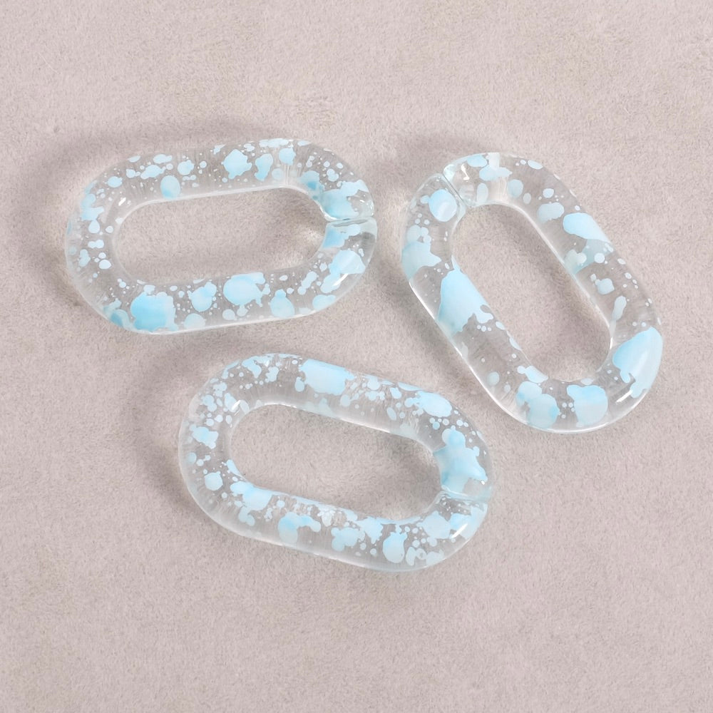 4 maillons ovale 27mm en acétate transparent moucheté bleu clair