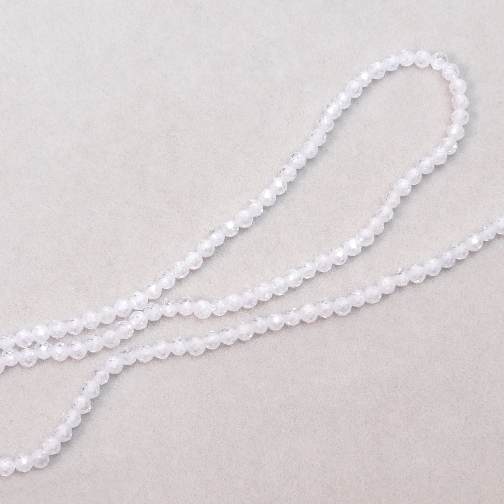 Fil de perles ronde facettée 2mm en Oxyde de Zirconium ou Zircone cubique