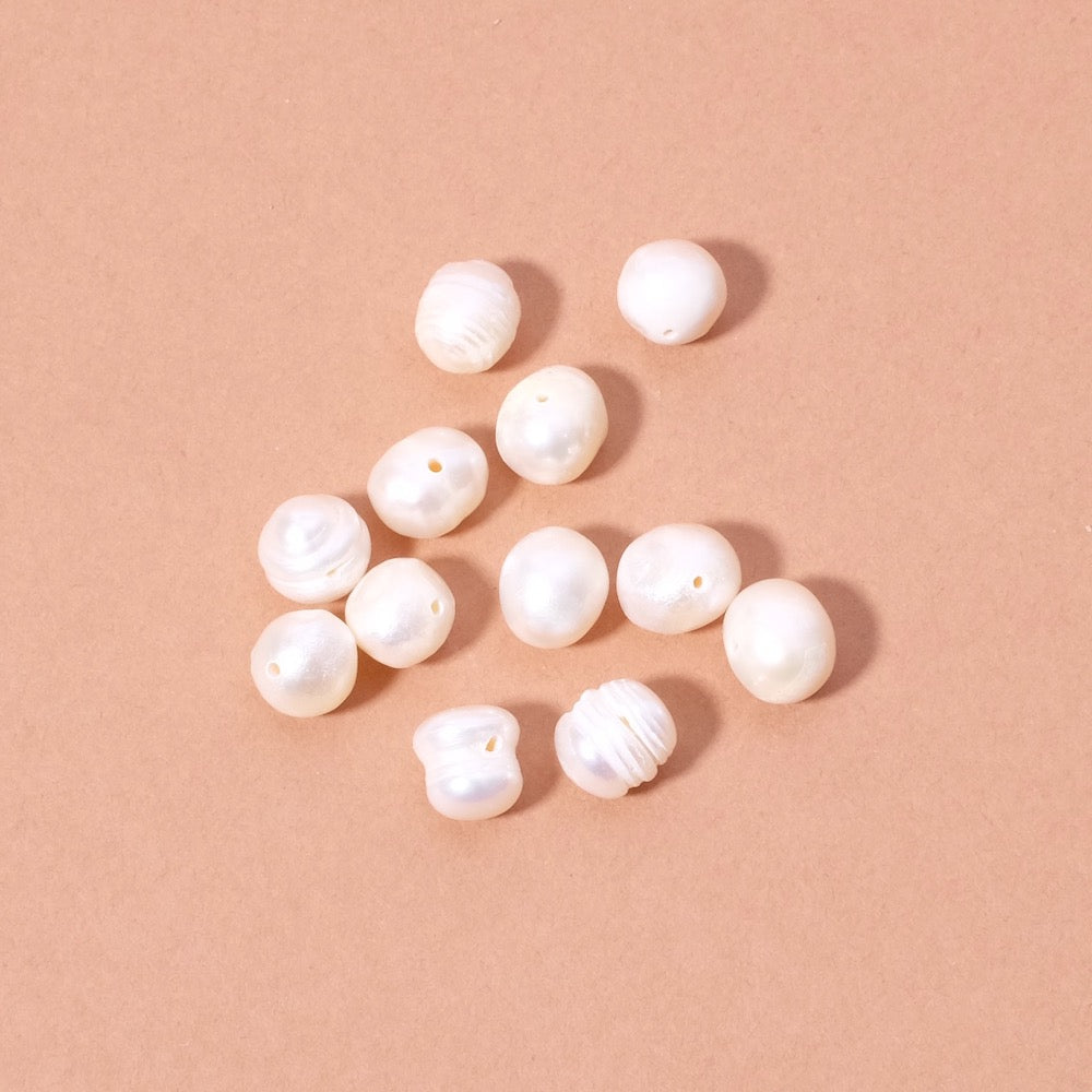 10 perles ovales irrégulières de Nacre naturelle