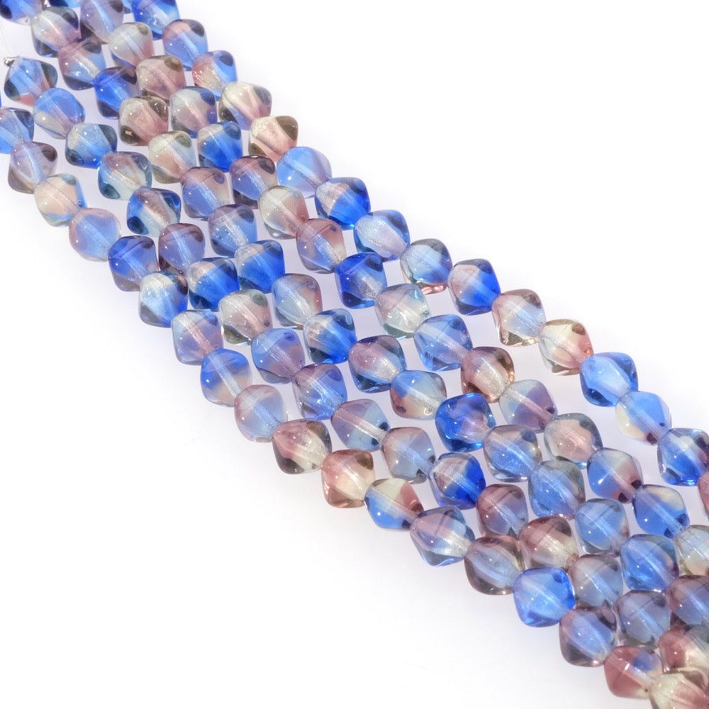 Fil de perles de Bohème toupies facettées 6mm bleu violet transparent