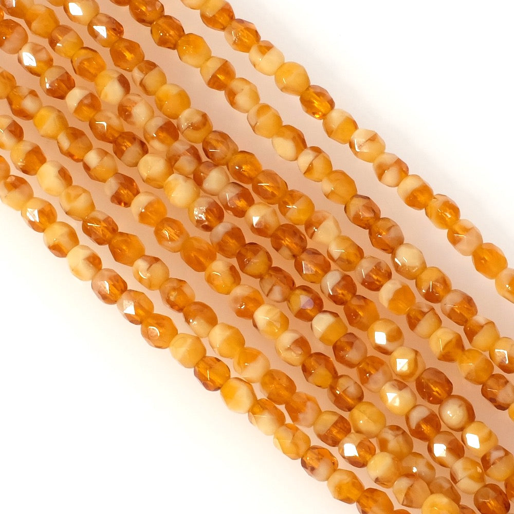 Fil de perles de Bohème rondes facettées 4mm orange miel