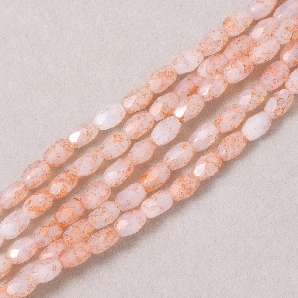 Fil de perles de Bohème Olives facettées 6x4mm Blanc opaline moucheté cuivré