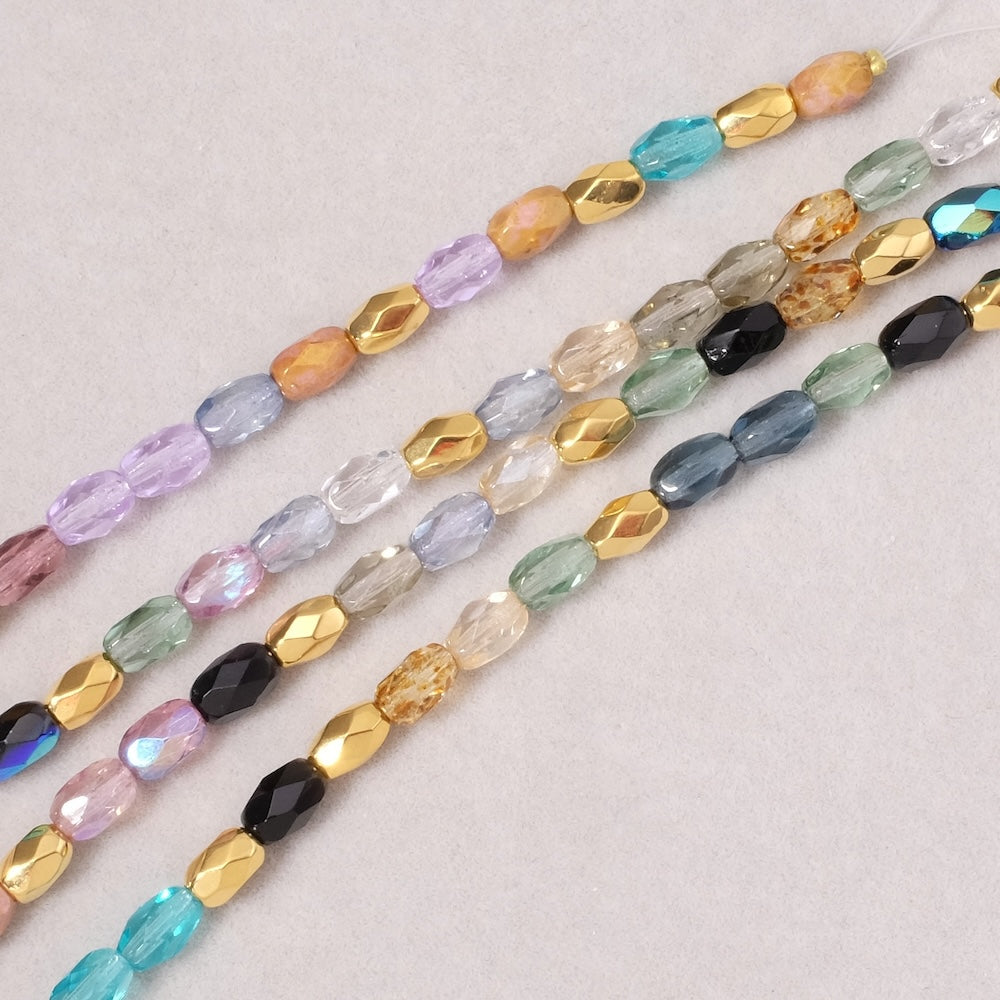 Fil de perles de Bohème Olives facettées 6x4mm mix doré violet