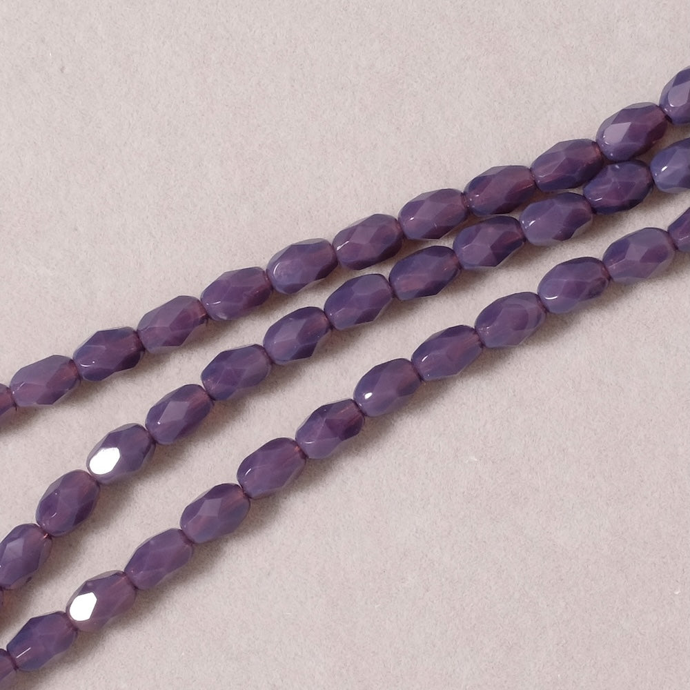 Fil de perles de Bohème Olives facettées 7x5mm violet semi opaque