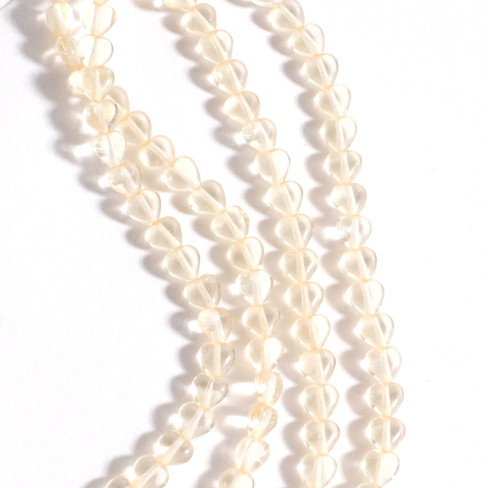 Fil de perles de Bohème coeur 6mm beige transparent
