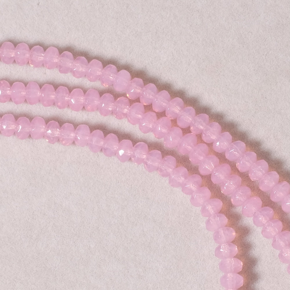 Fil de perles de Bohème facettées 3x5mm Rose semi transparent